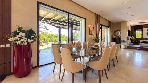 Dining room opening onto the garden at the Iligh villa