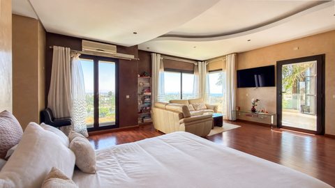 Bedroom and sitting area inside the Iligh villa