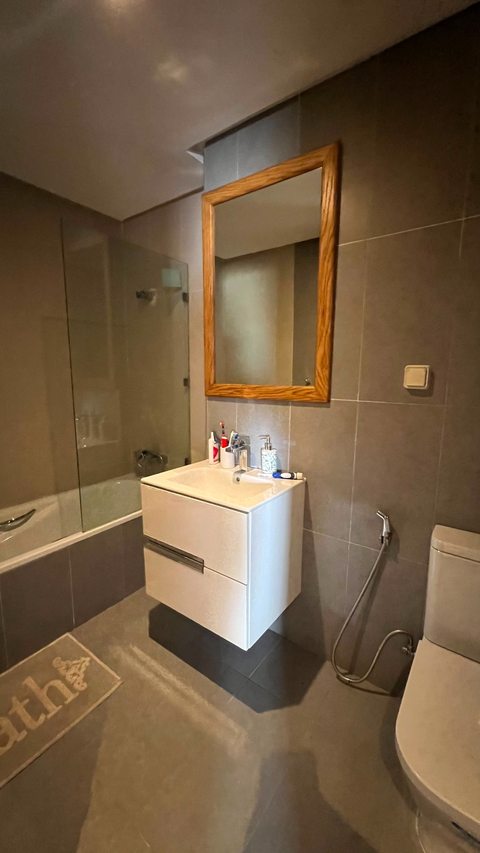 Bathroom with vanity and shower