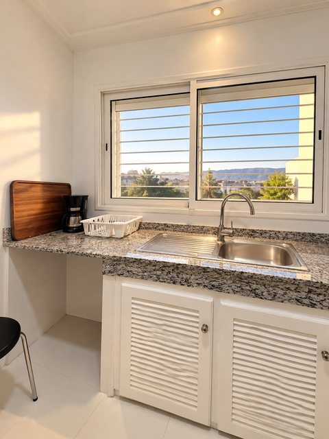 Kitchen sink and window inside the Imi Ouaddar villa